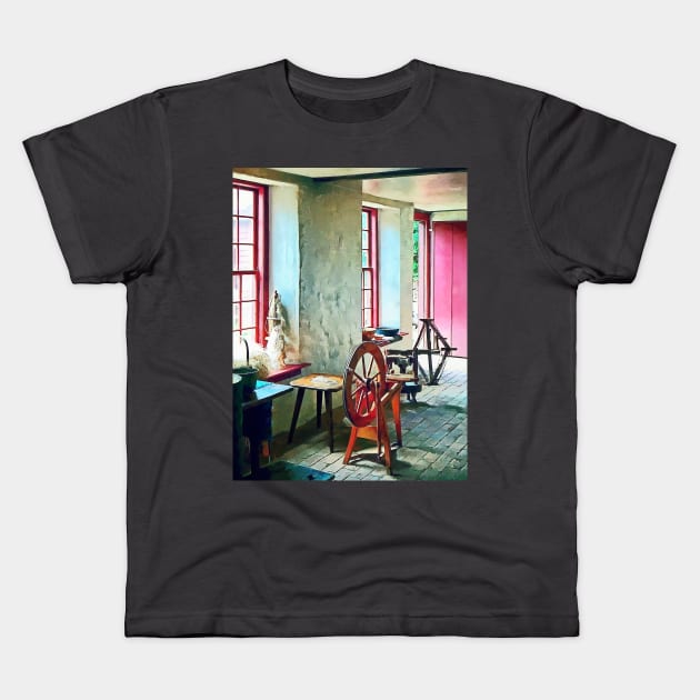 Spinning Wheel Near Window Kids T-Shirt by SusanSavad